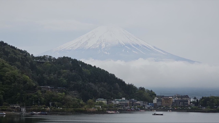 Mount Fuji rising above a lakeside town