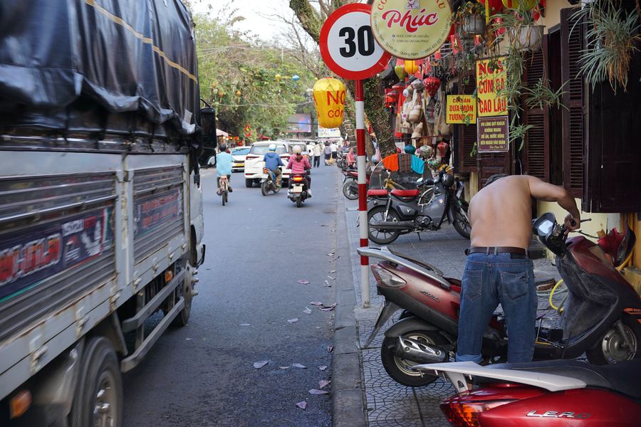 A lively street scene with scooters in Vietnam